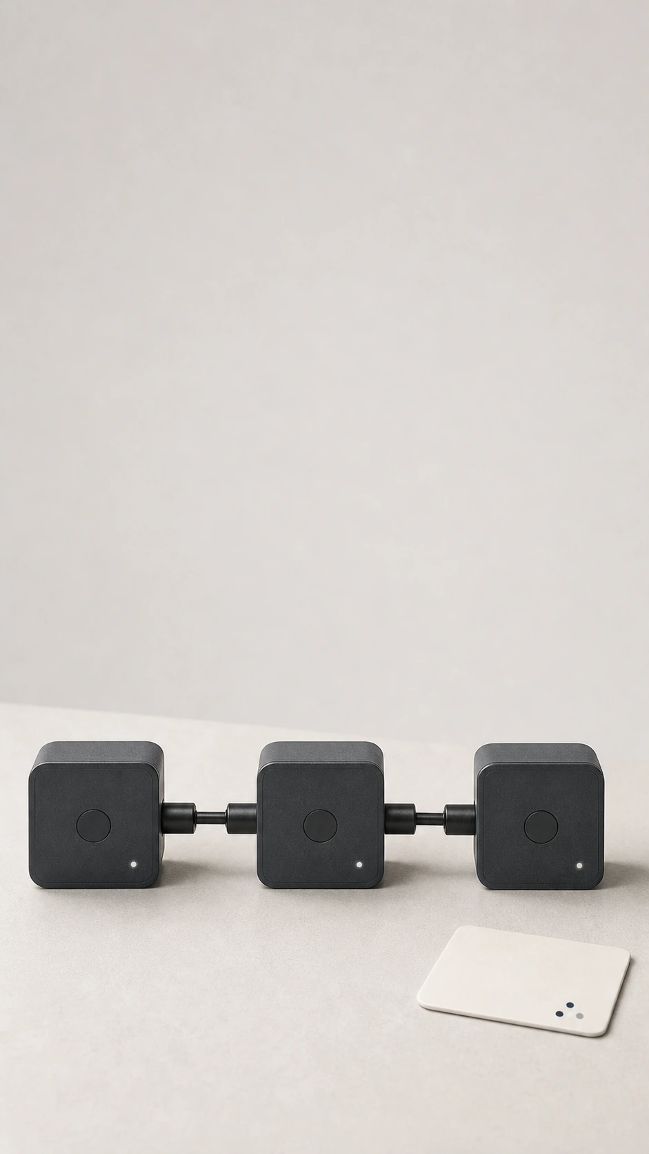 Connected charcoal automation modules on a light studio background